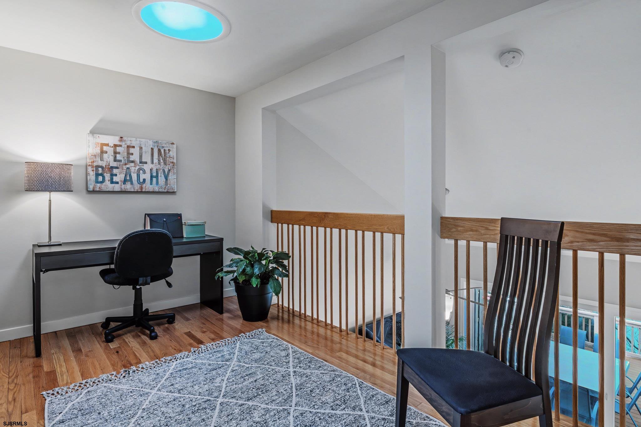 5 Beacon Lane Brigantine, NJ 08203 - Photo 21 of 39 a living room with furniture rug and a window