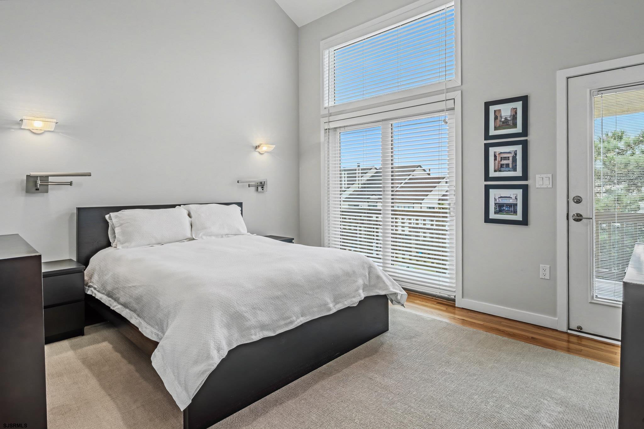 5 Beacon Lane Brigantine, NJ 08203 - Photo 22 of 39 a bedroom with a large bed and a window