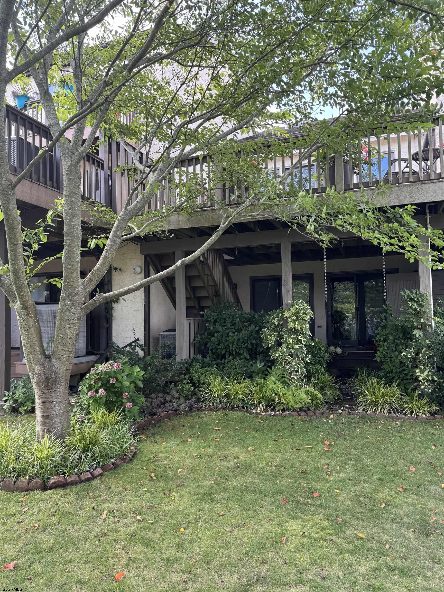 5 Beacon Lane Brigantine, NJ 08203 - Photo 35 of 39 a front view of a house with garden