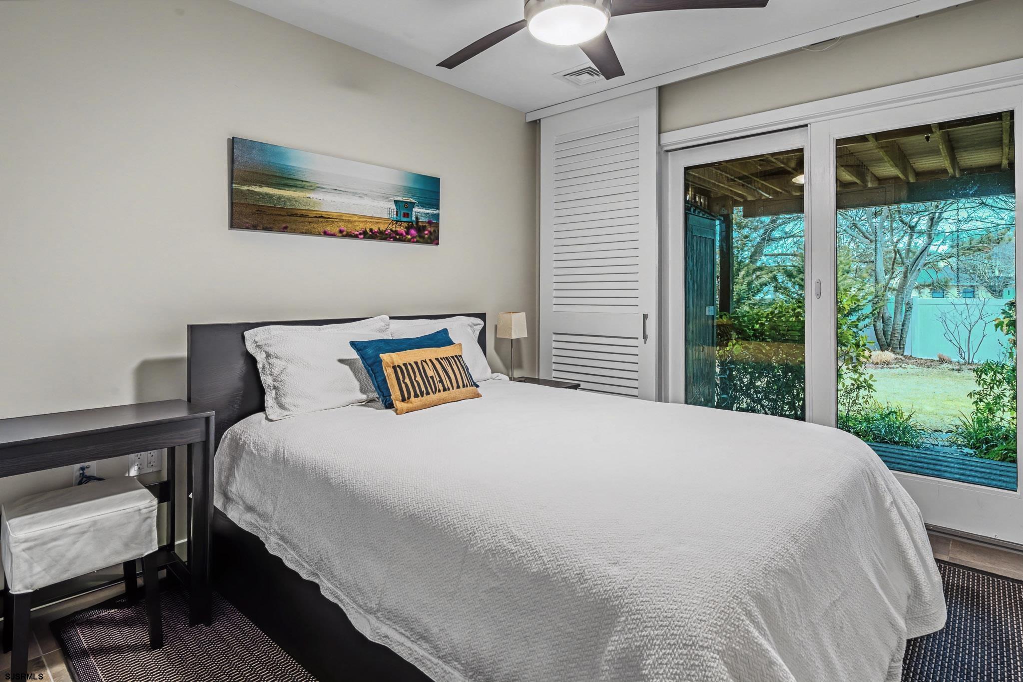 5 Beacon Lane Brigantine, NJ 08203 - Photo 6 of 39 a bedroom with a bed and a large window