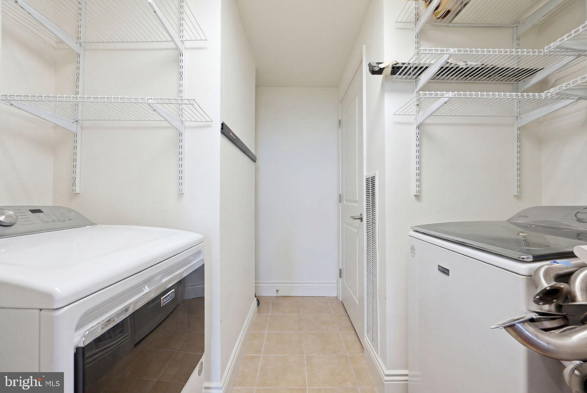 11990 Market Street, Unit 2103 Reston, VA 20190 - Photo 51 of 78 Bright and functional laundry space.