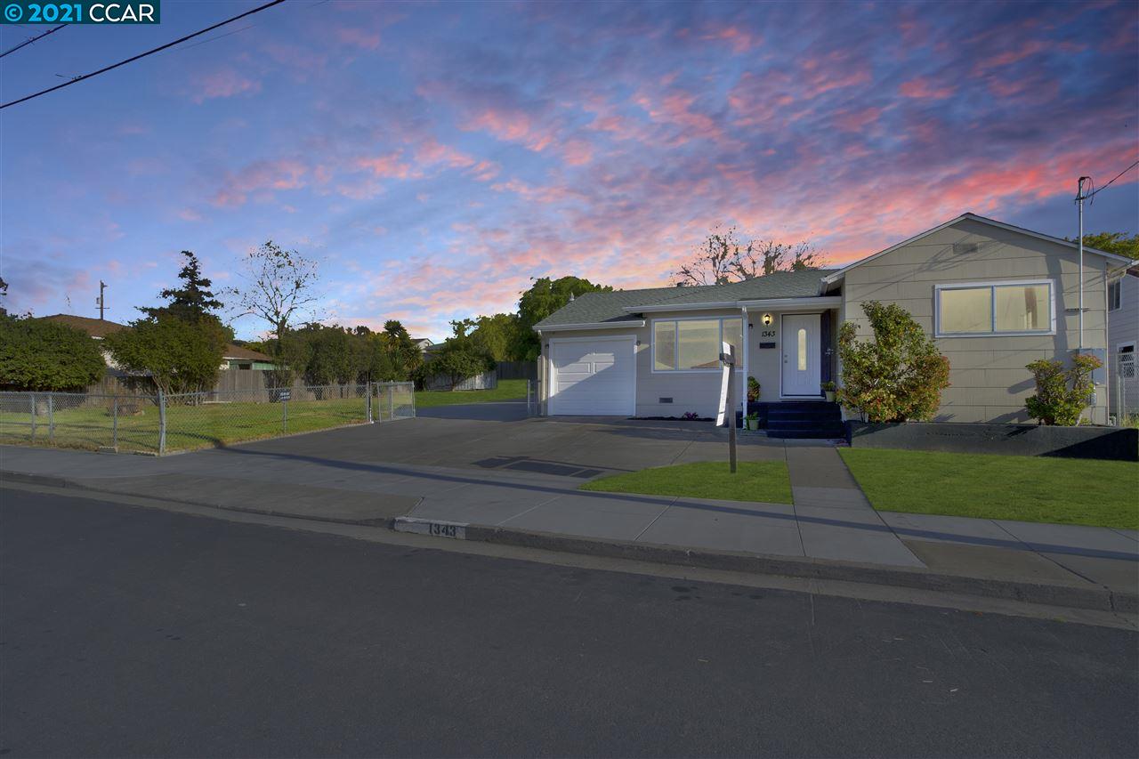 1343 6th Rodeo, CA 94572 - Photo 1 of 1 a view of a house with a yard and a street