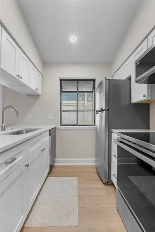 a kitchen with a stove and a microwave