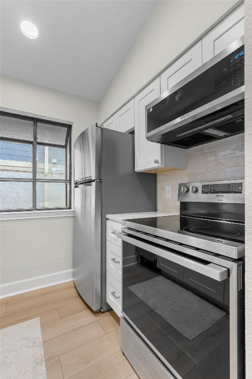 2215 Post Road, Unit 2051 Austin, TX 78704 - Photo 12 of 39 a kitchen with a stove and a microwave