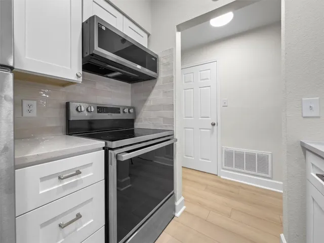 a bathroom with a sink a toilet and bathtub