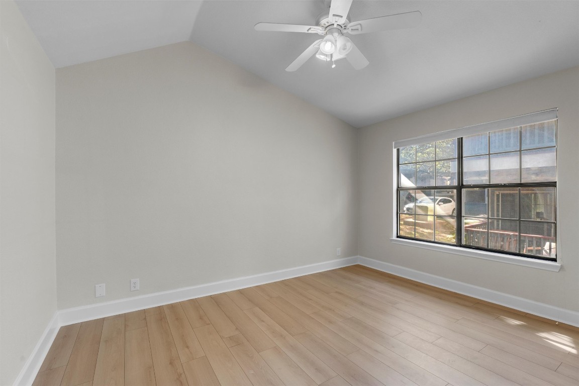 2215 Post Road, Unit 2051 Austin, TX 78704 - Photo 17 of 39 wooden floor in an empty room with a window