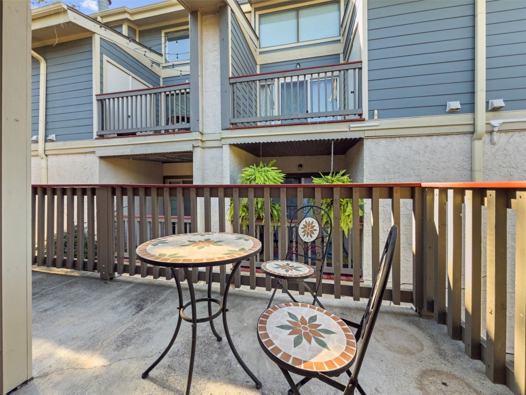 2215 Post Road, Unit 2051 Austin, TX 78704 - Photo 21 of 37 a view of a chair and tables in the balcony