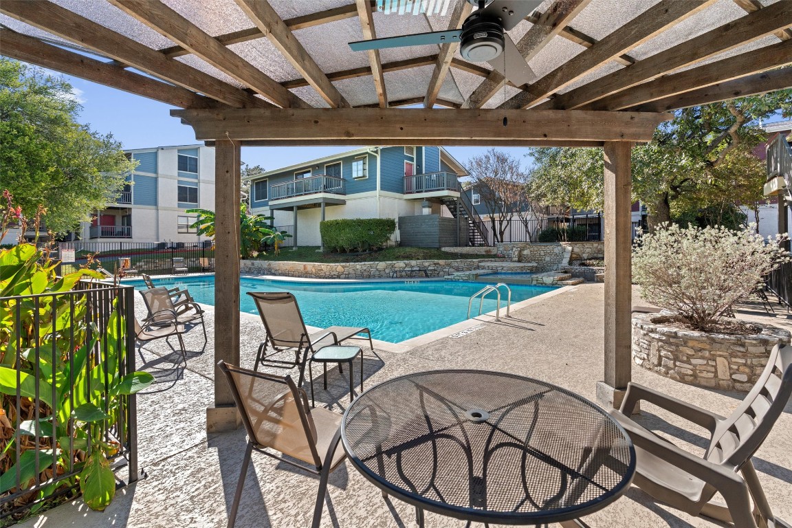 2215 Post Road, Unit 2051 Austin, TX 78704 - Photo 32 of 39 a patio with a yard table and chairs