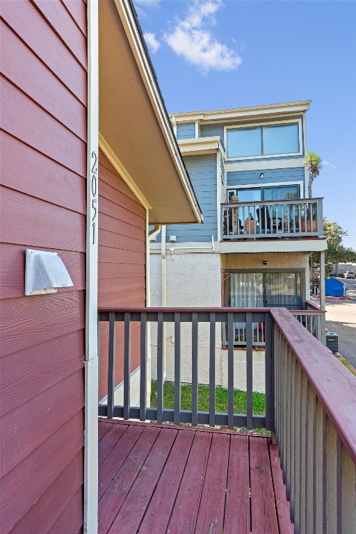 2215 Post Road, Unit 2051 Austin, TX 78704 - Photo 35 of 37 a balcony with wooden floor