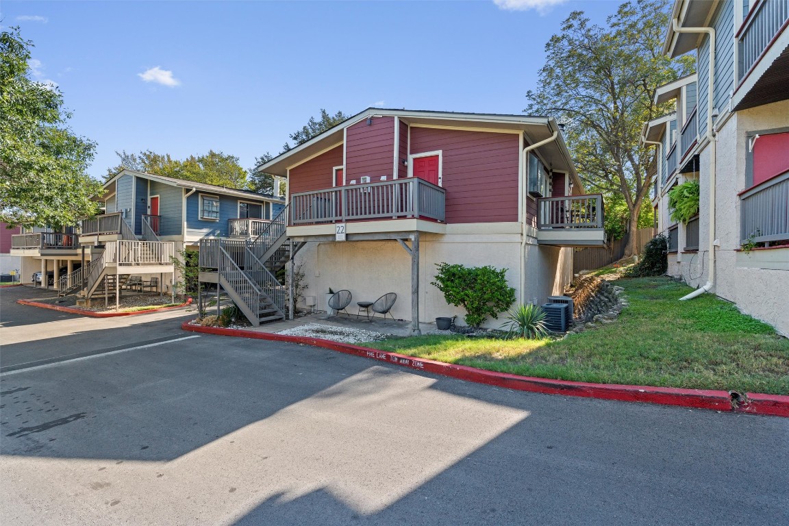 2215 Post Road, Unit 2051 Austin, TX 78704 - Photo 39 of 39 a front view of a house with a yard and garage