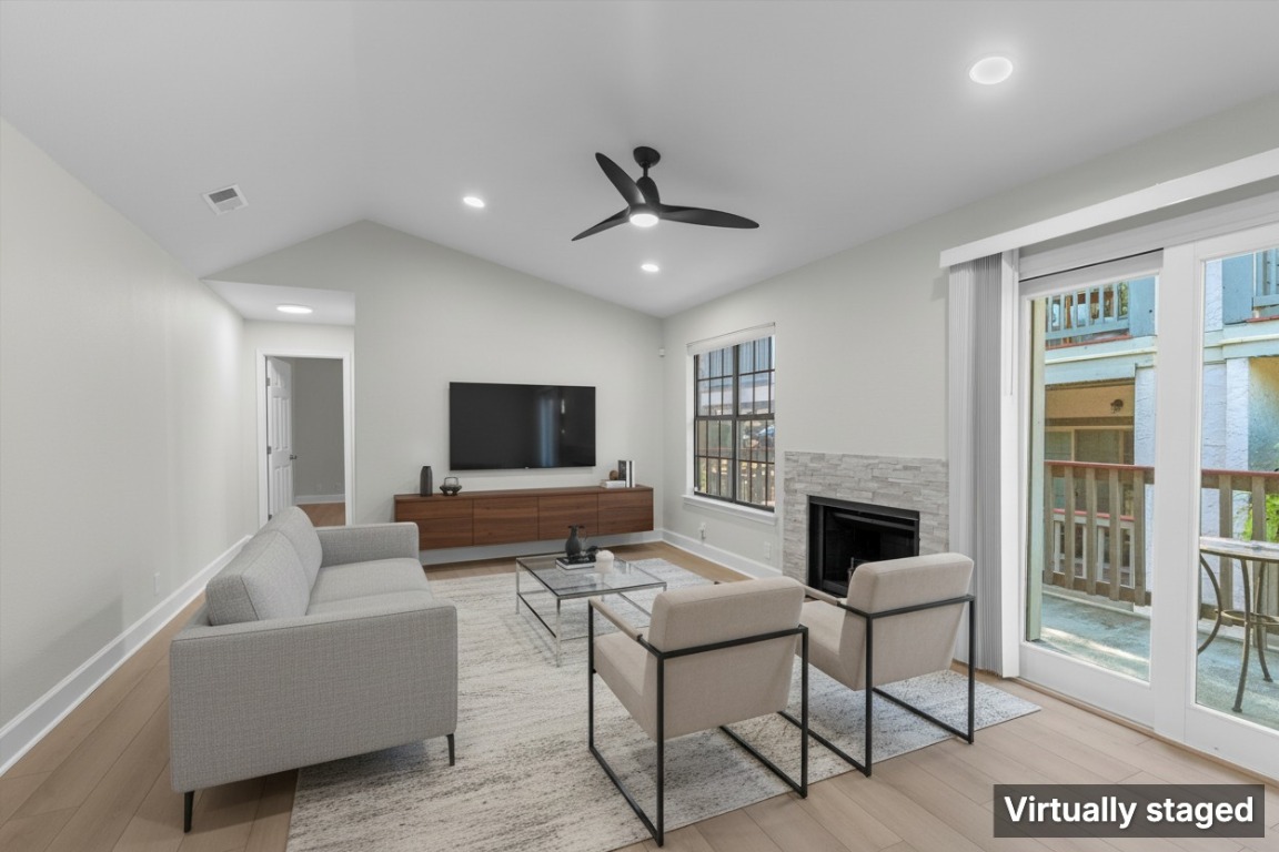 2215 Post Road, Unit 2051 Austin, TX 78704 - Photo 6 of 37 a living room with furniture and a fireplace