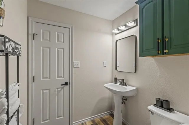 a bathroom with a sink a mirror and vanity