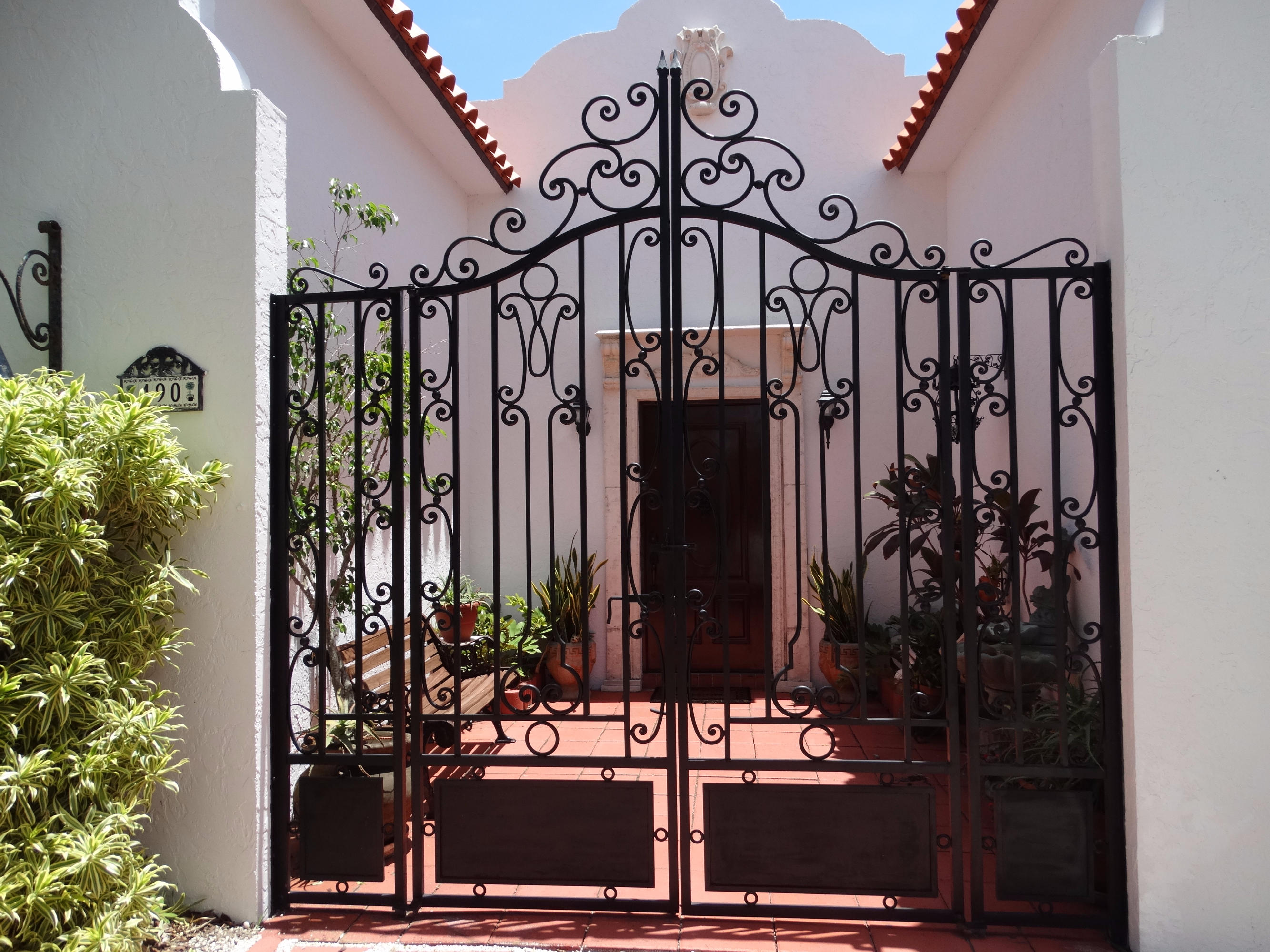 490 Neptune Road Juno Beach, FL 33408 - Photo 3 of 22 Front entry Gate