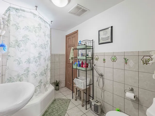 a bathroom with a toilet and a bathtub