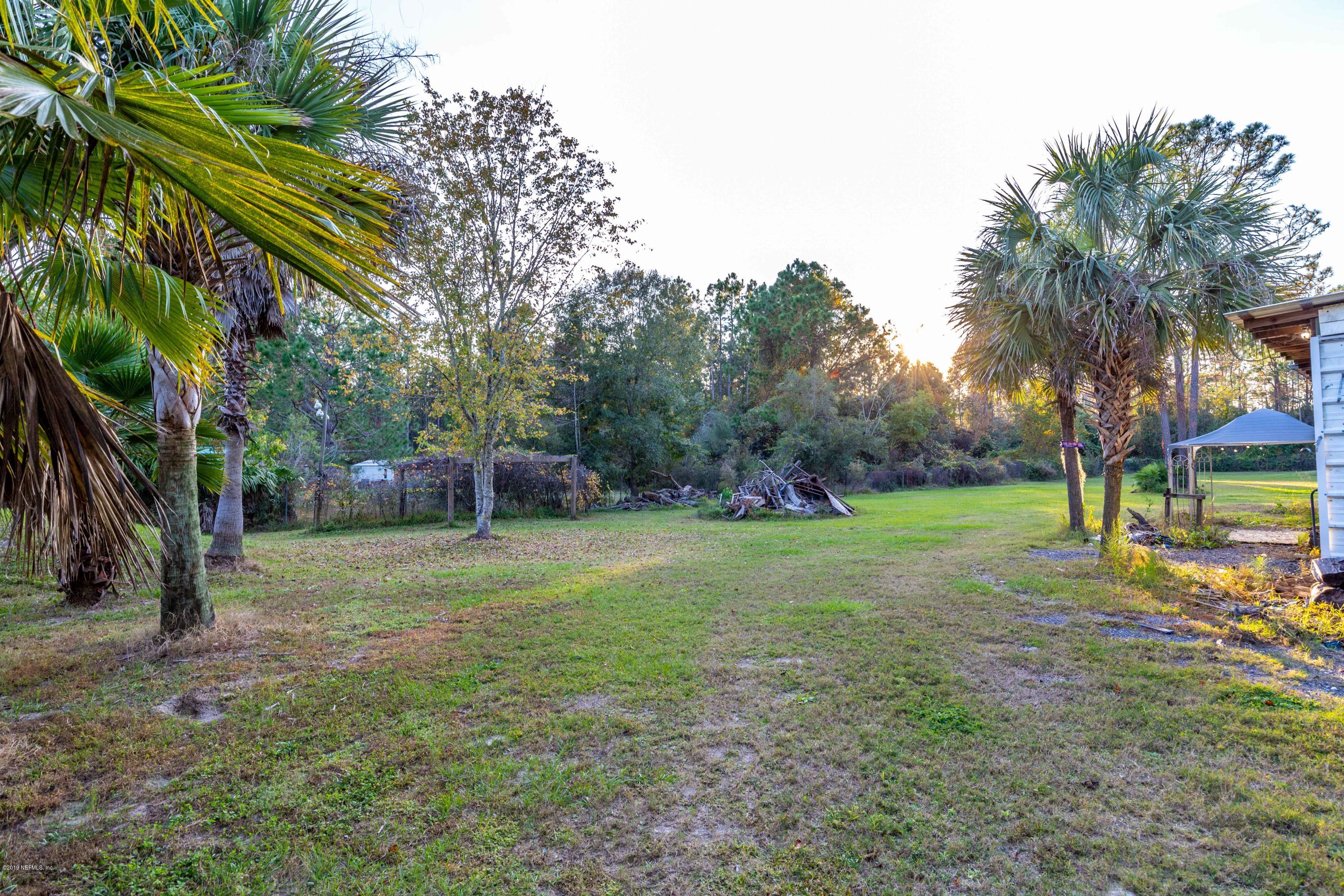 7840 Old Middleburg Road South Jacksonville, FL 32222 - Photo 12 of 46 a backyard of a house with lots of green space