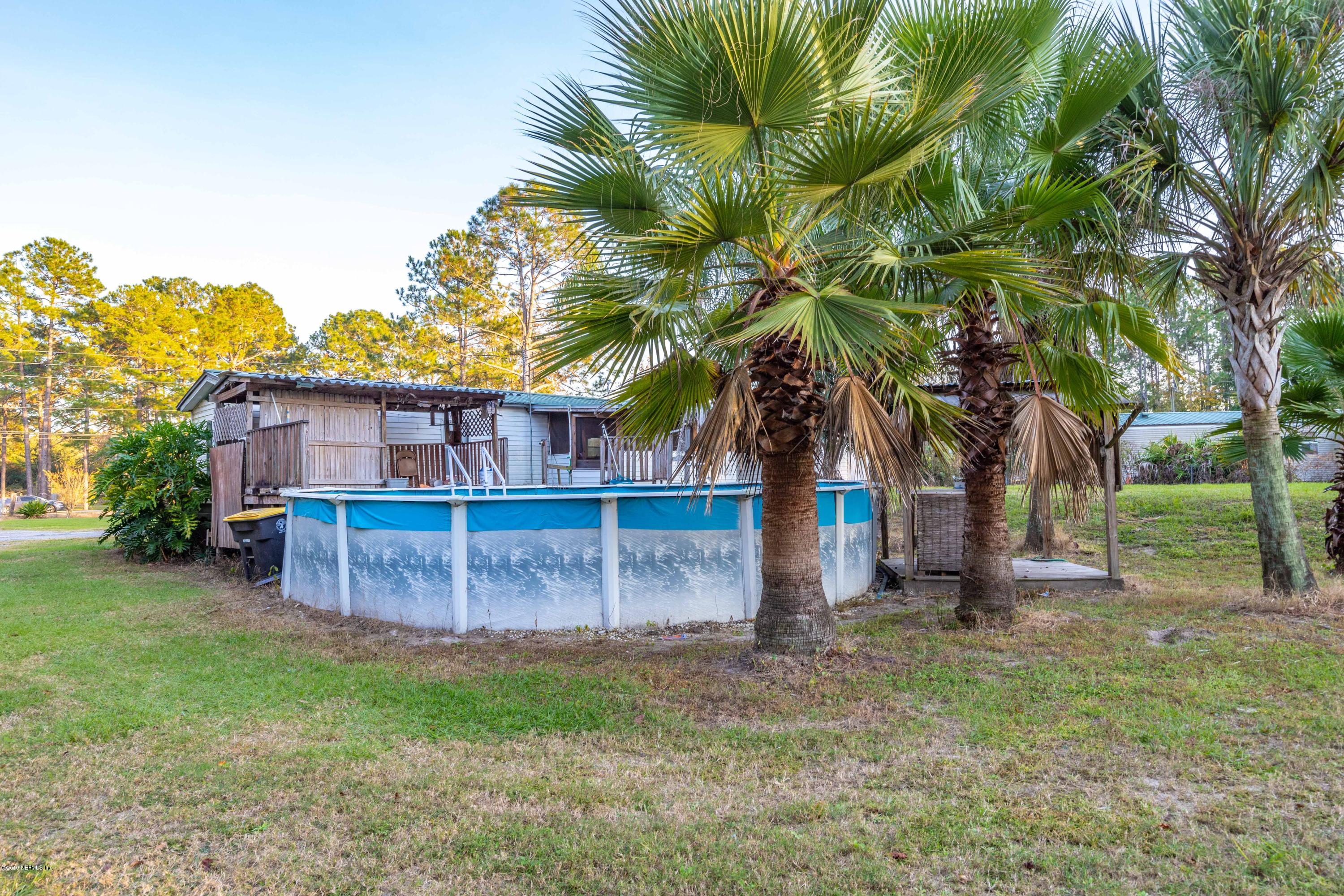 7840 Old Middleburg Road South Jacksonville, FL 32222 - Photo 14 of 46 a view of a house with a yard