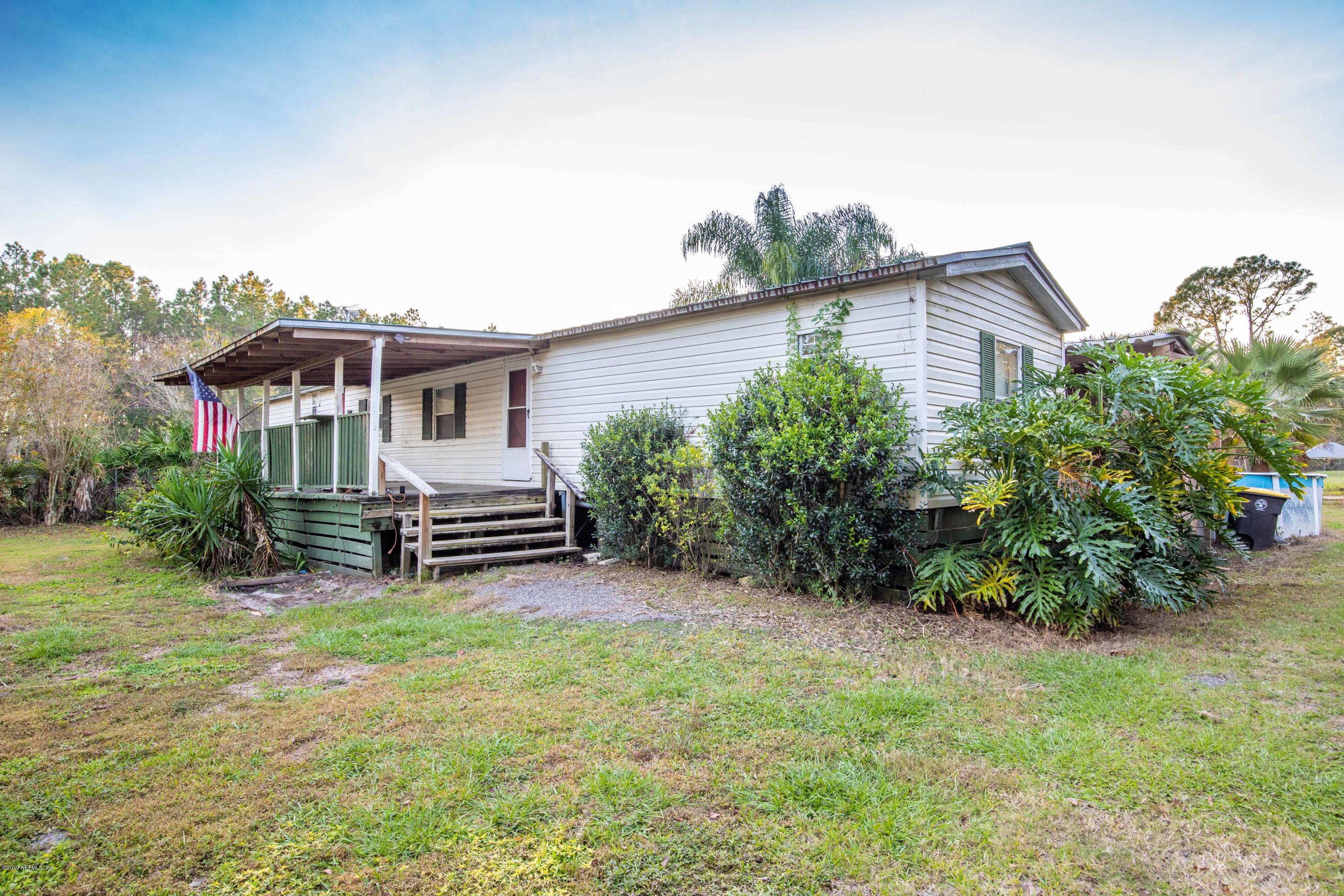 7840 Old Middleburg Road South Jacksonville, FL 32222 - Photo 2 of 46 a view of a house with a yard and sitting area
