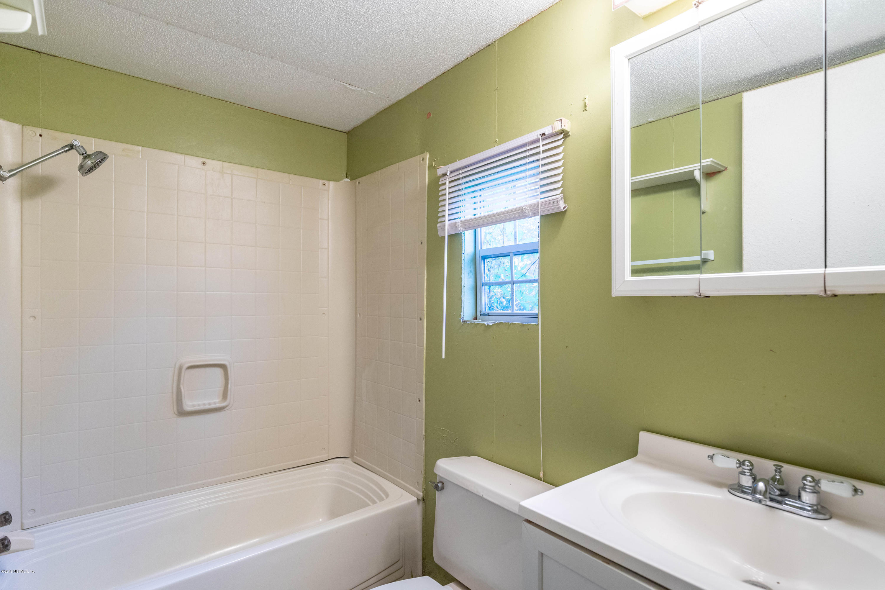 7840 Old Middleburg Road South Jacksonville, FL 32222 - Photo 23 of 46 a bathroom with a sink and a bathtub