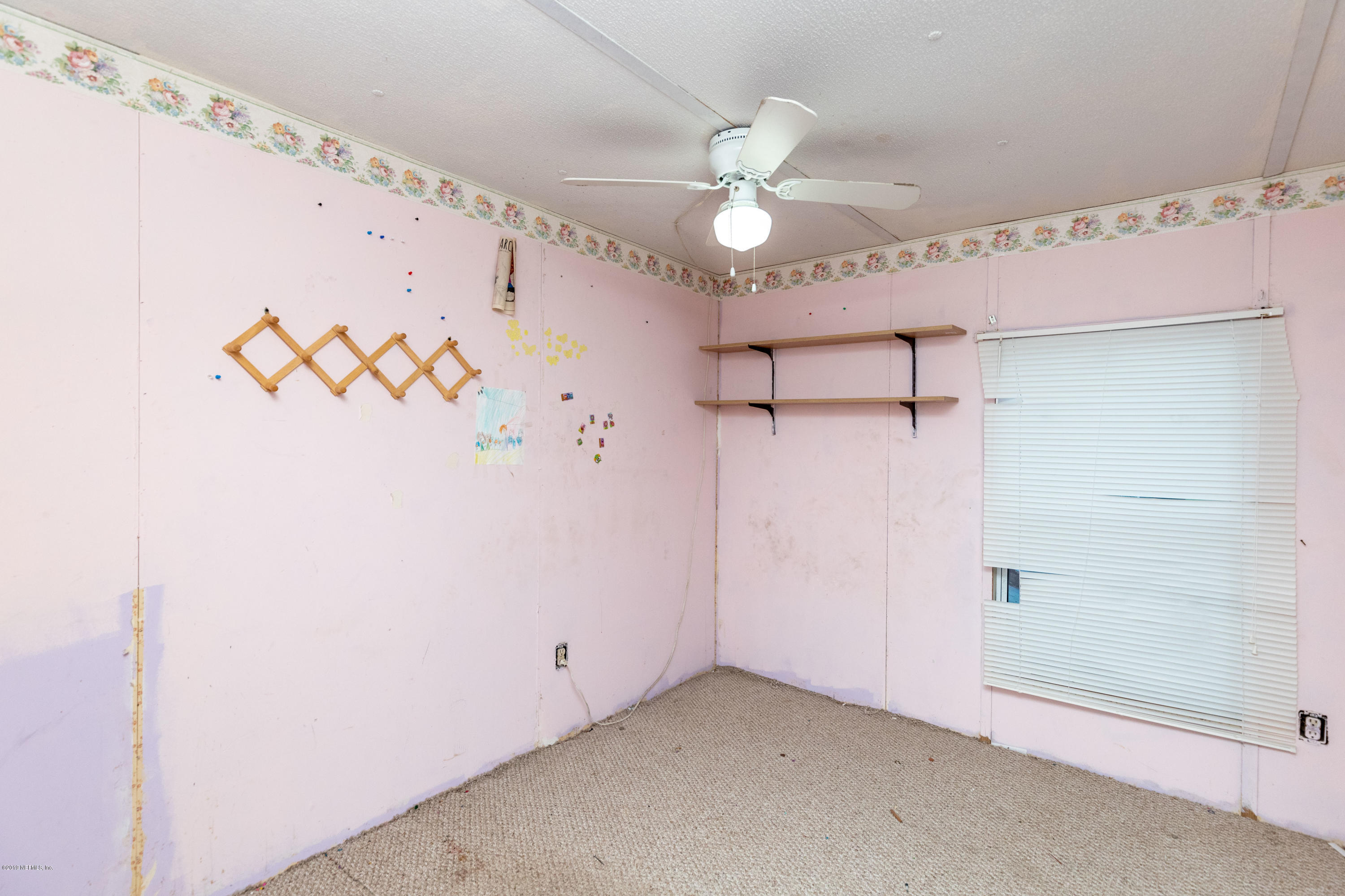 7840 Old Middleburg Road South Jacksonville, FL 32222 - Photo 25 of 46 a view of a room with window and a ceiling fan