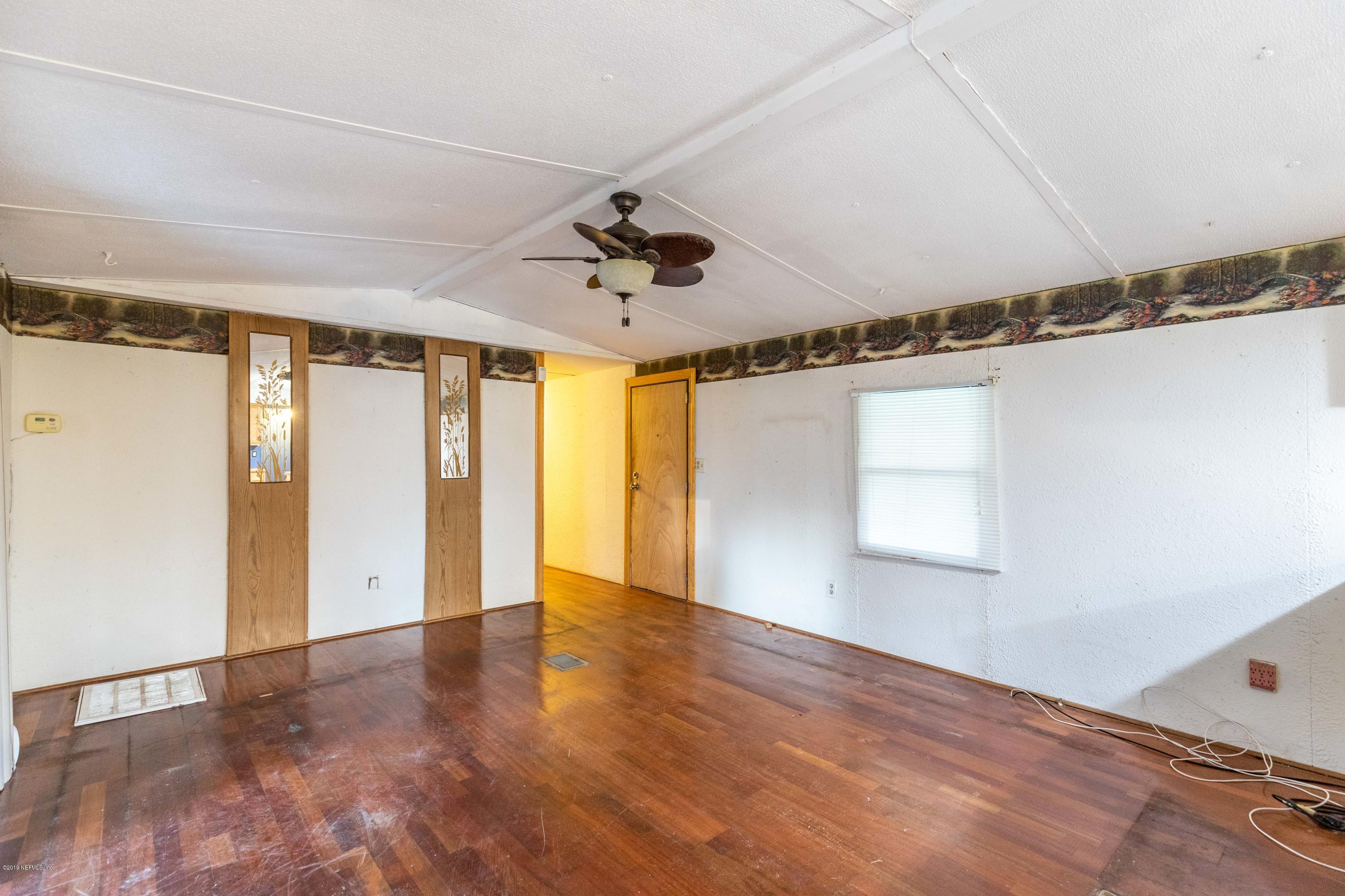 7840 Old Middleburg Road South Jacksonville, FL 32222 - Photo 3 of 46 a view of an empty room with a window