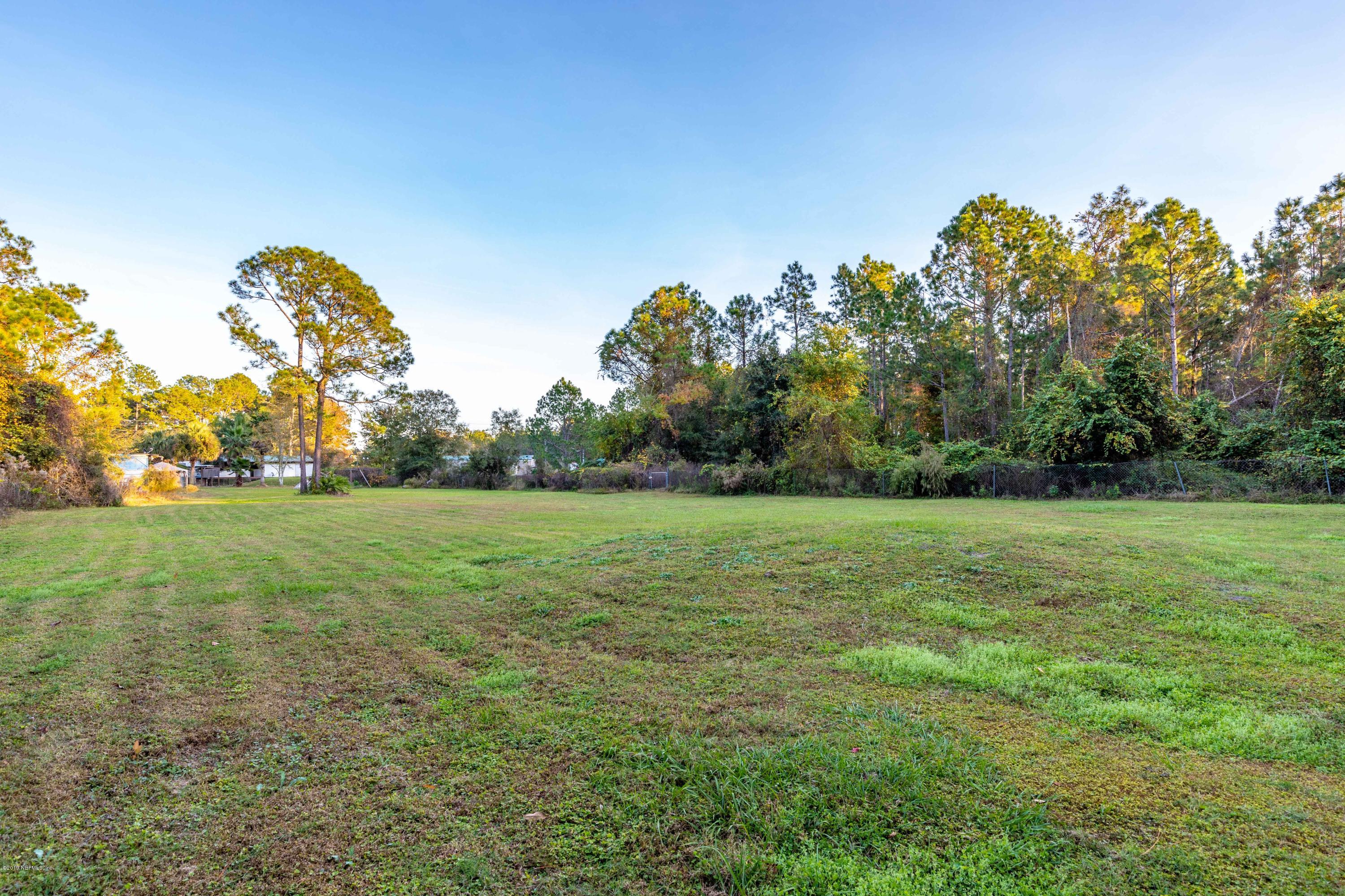 7840 Old Middleburg Road South Jacksonville, FL 32222 - Photo 38 of 46 a backyard of a house with lots of green space