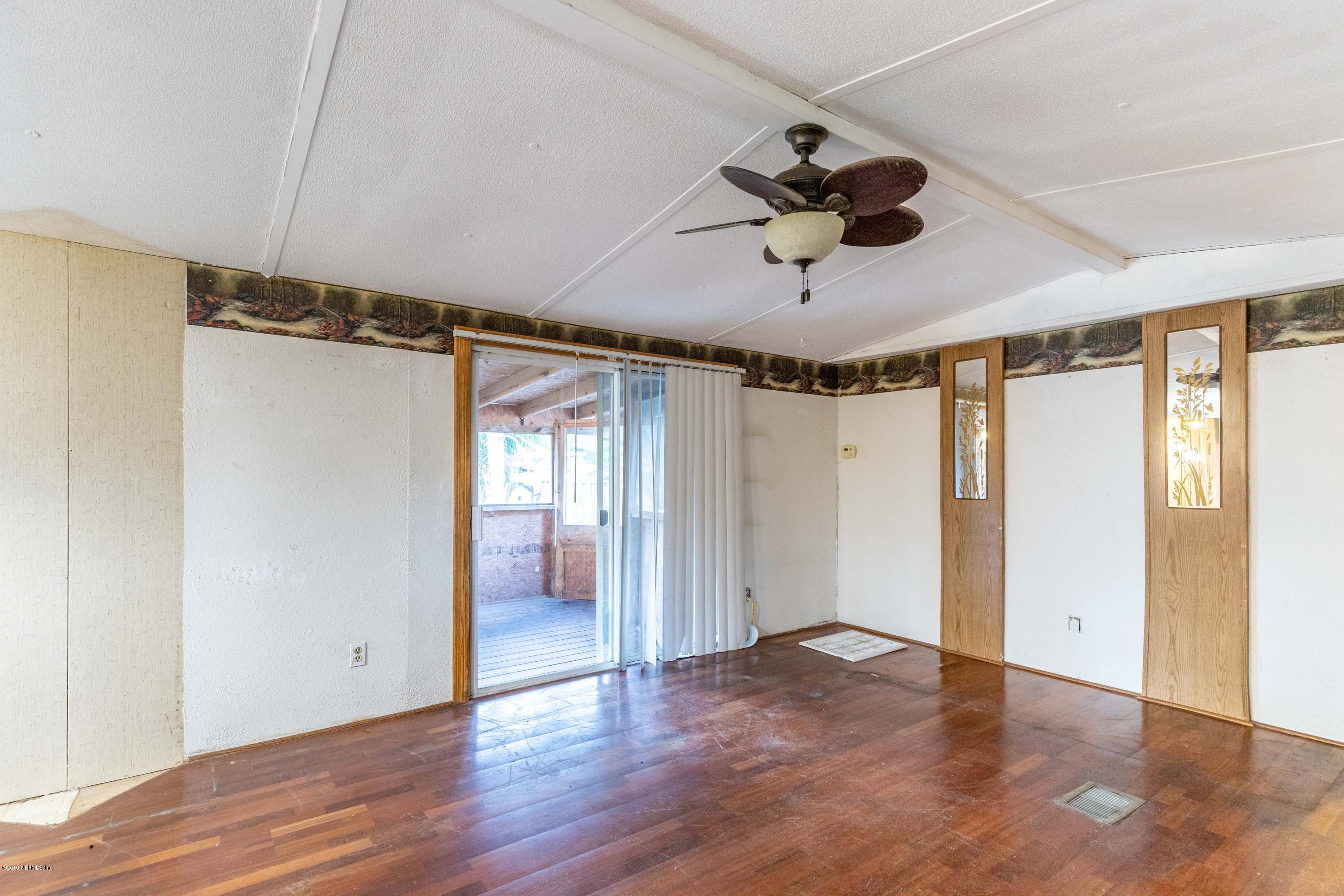 7840 Old Middleburg Road South Jacksonville, FL 32222 - Photo 5 of 46 a view of an empty room with a window