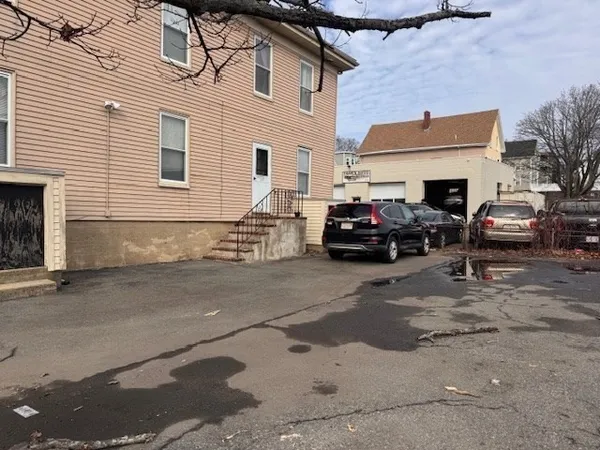 a view of a car park in front of house