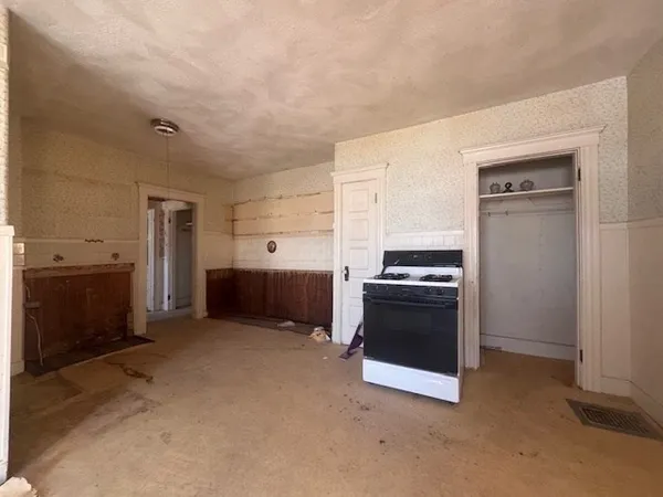 a view of a kitchen with a sink and a stove