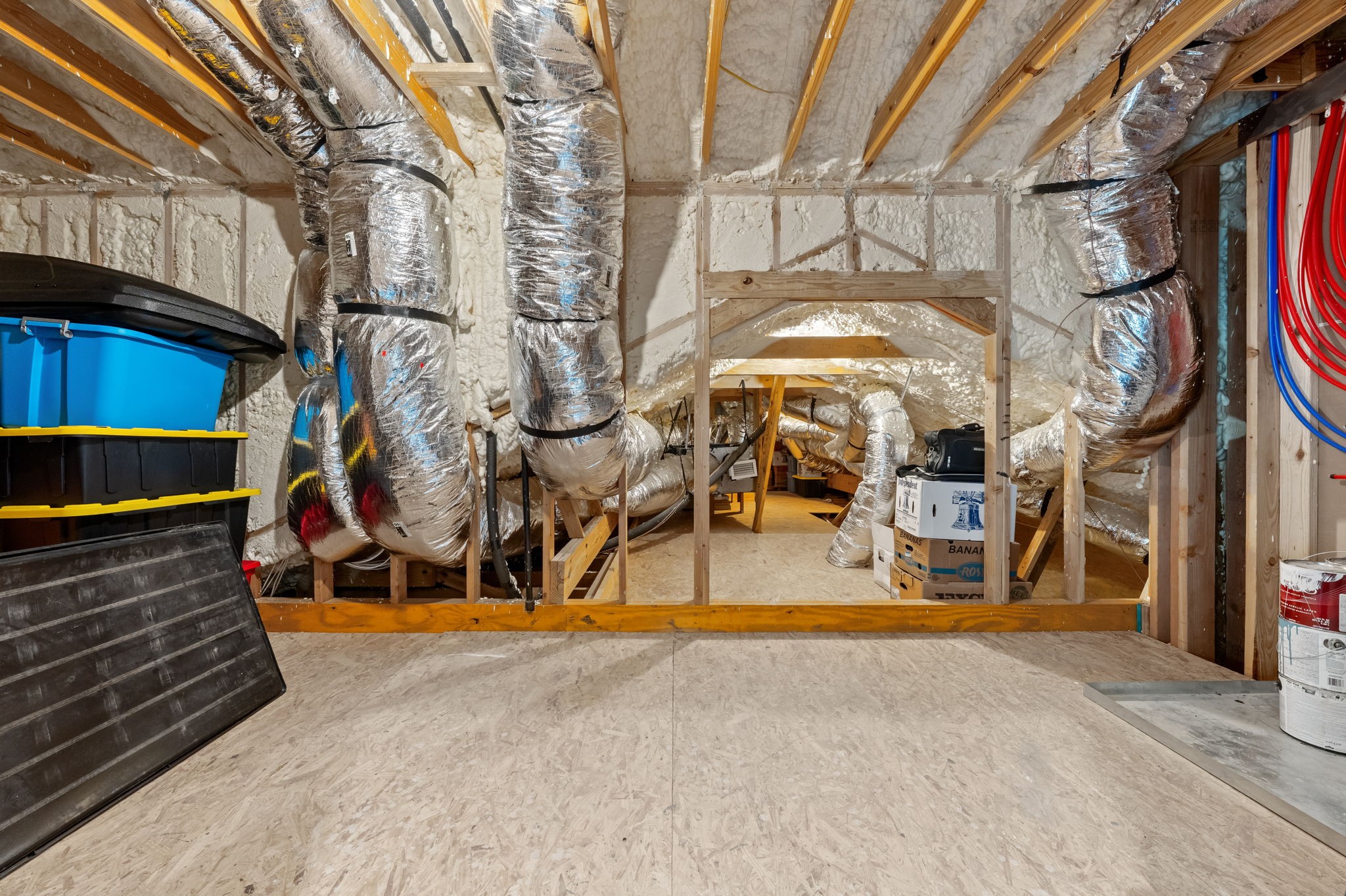 2856 Wolcek Road Crosby, TX 77532 - Photo 43 of 48 attic with exposed ductwork and spray foam insulation. The space has ample room for storage. The energy saver insulation yields lower power bills and the attic is never sweltering during hot Texas months. This is a great feature!!