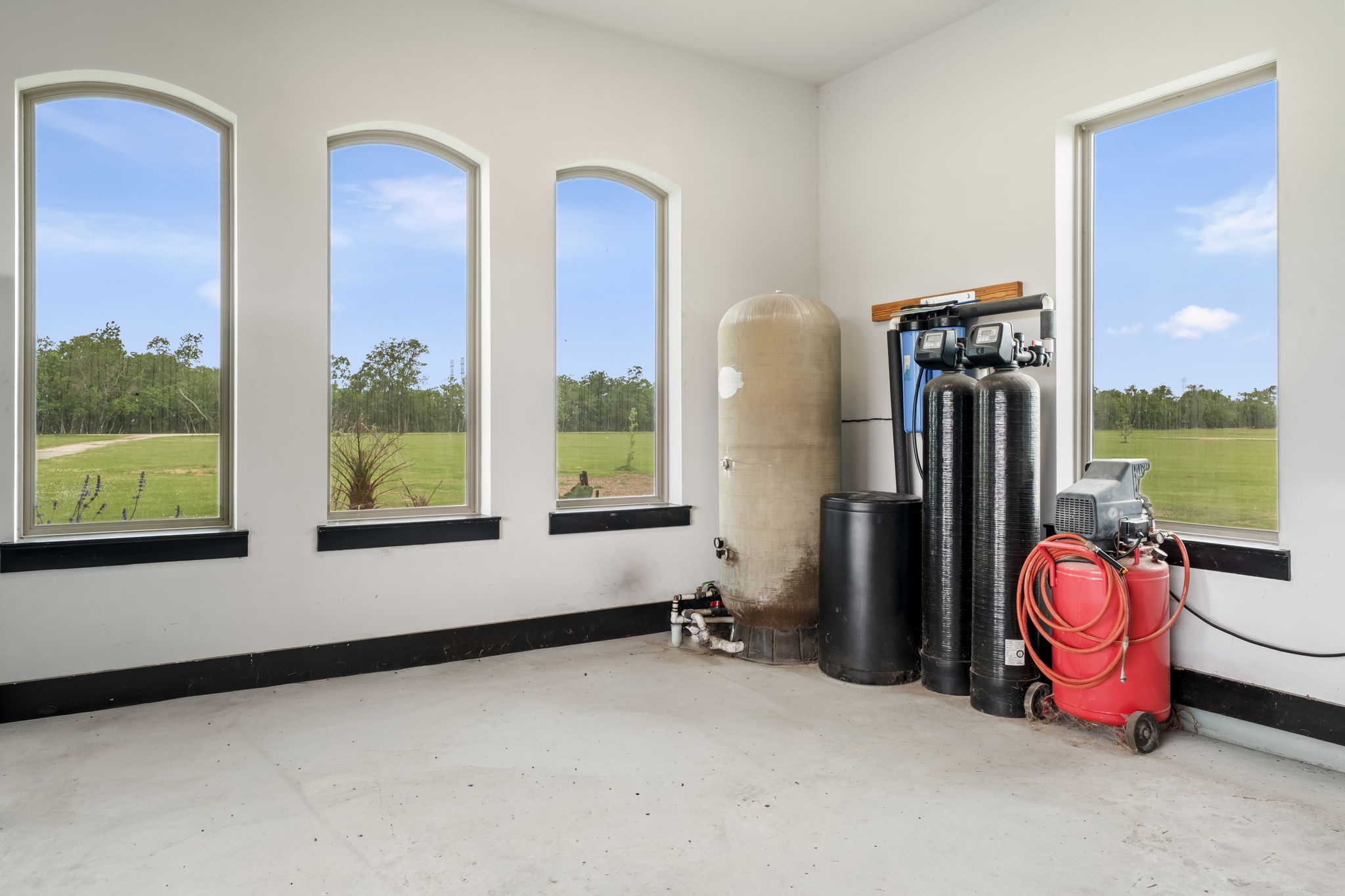 2856 Wolcek Road Crosby, TX 77532 - Photo 44 of 48 Water softener system is located in the oversized 2 car garage. Also included in the garage is an electric car charging connection.