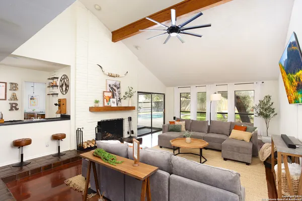 a living room with furniture and a fireplace