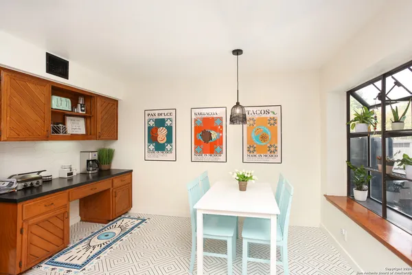 a bedroom with furniture and a window