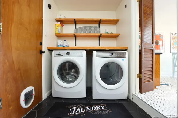 a utility room with dryer and washer