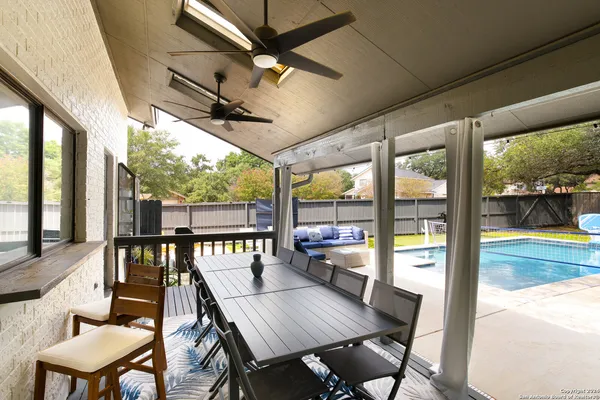 a view of a patio with a table chairs and a table