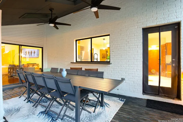 a view of a dining room with furniture and window