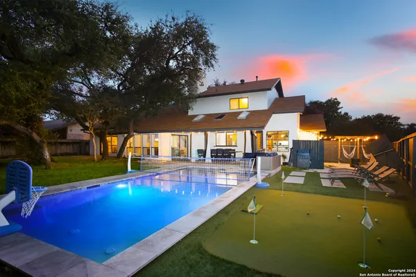swimming pool view with a outdoor seating