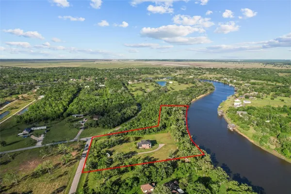 a view of a lake with a yard