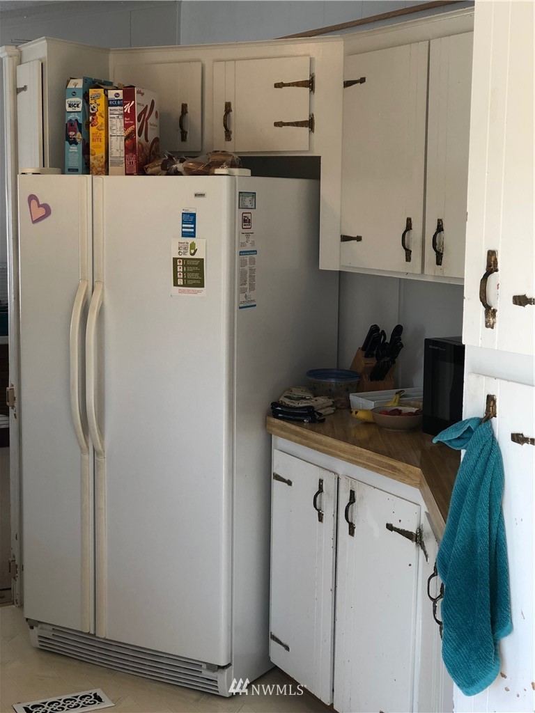 739 Lange Road Bellingham, WA 98226 - Photo 18 of 23 a kitchen with stainless steel appliances granite countertop a refrigerator and a stove