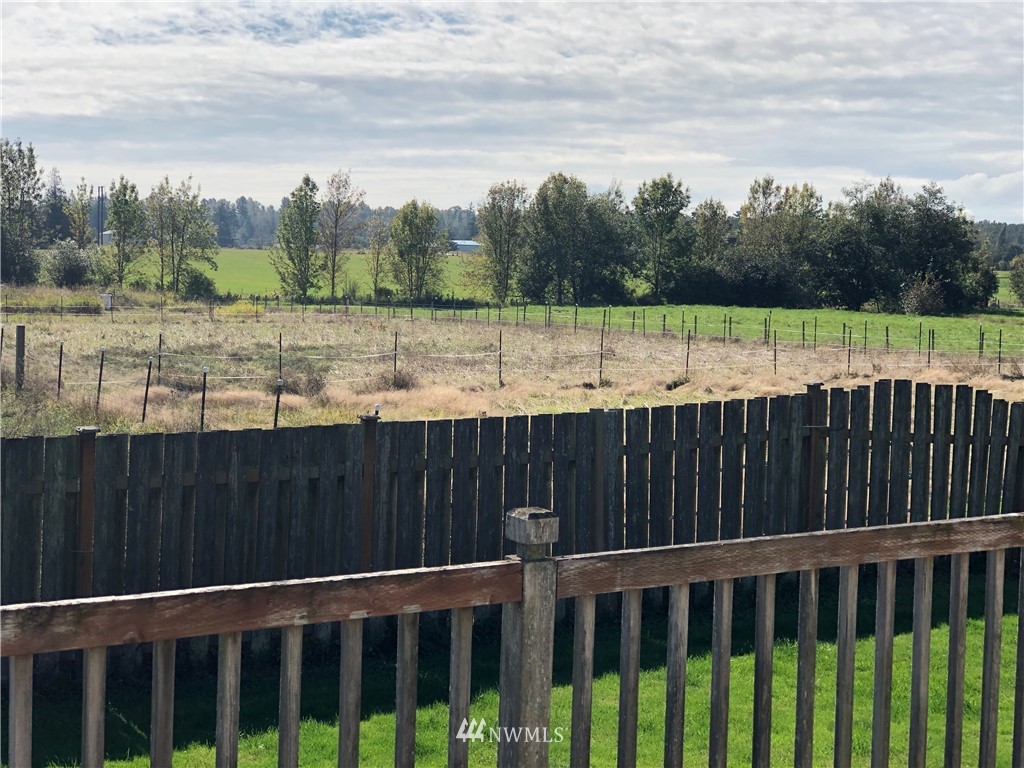 739 Lange Road Bellingham, WA 98226 - Photo 23 of 23 a view of a backyard with a lake
