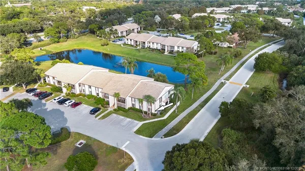 an aerial view of a house a yard and outdoor seating