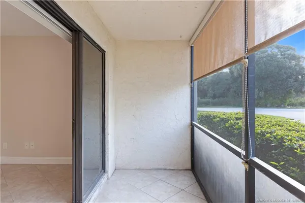 a tennis court with trees in the background