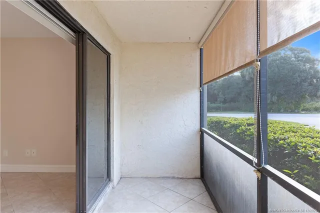 a tennis court with trees in the background