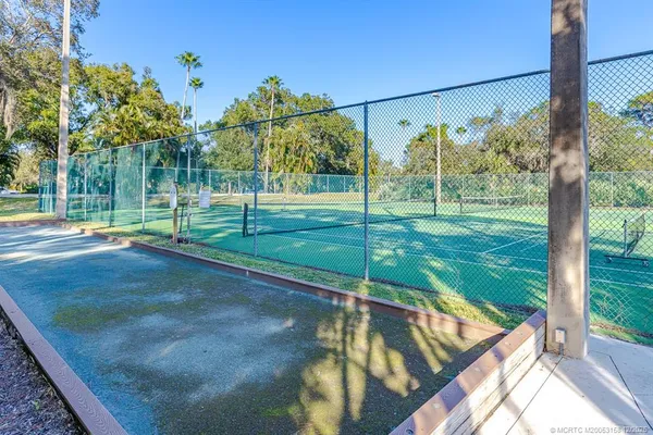 a view of a lake with a house in the background