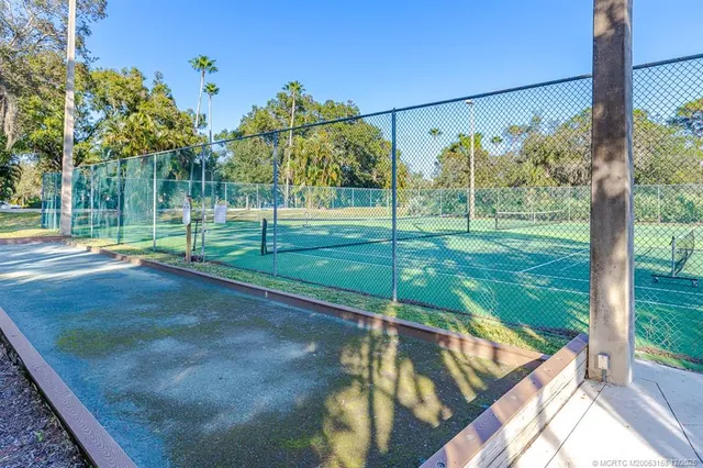 a view of a lake with a house in the background