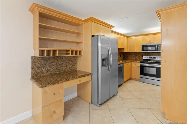 an empty room with windows and entrance