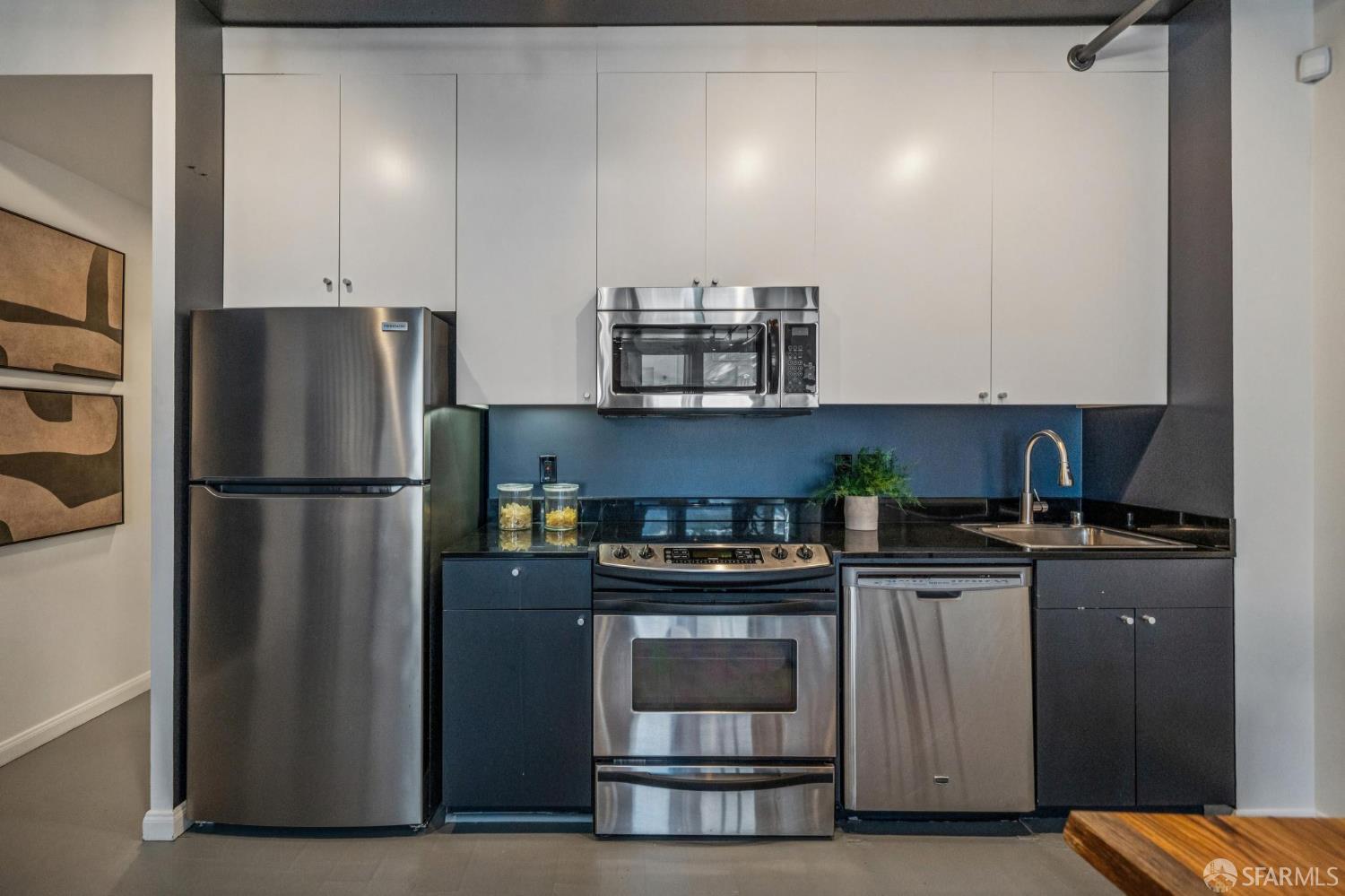 855 Folsom Street, Unit 112 San Francisco, CA 94107 - Photo 12 of 36 a kitchen with stainless steel appliances granite countertop a refrigerator sink and stove