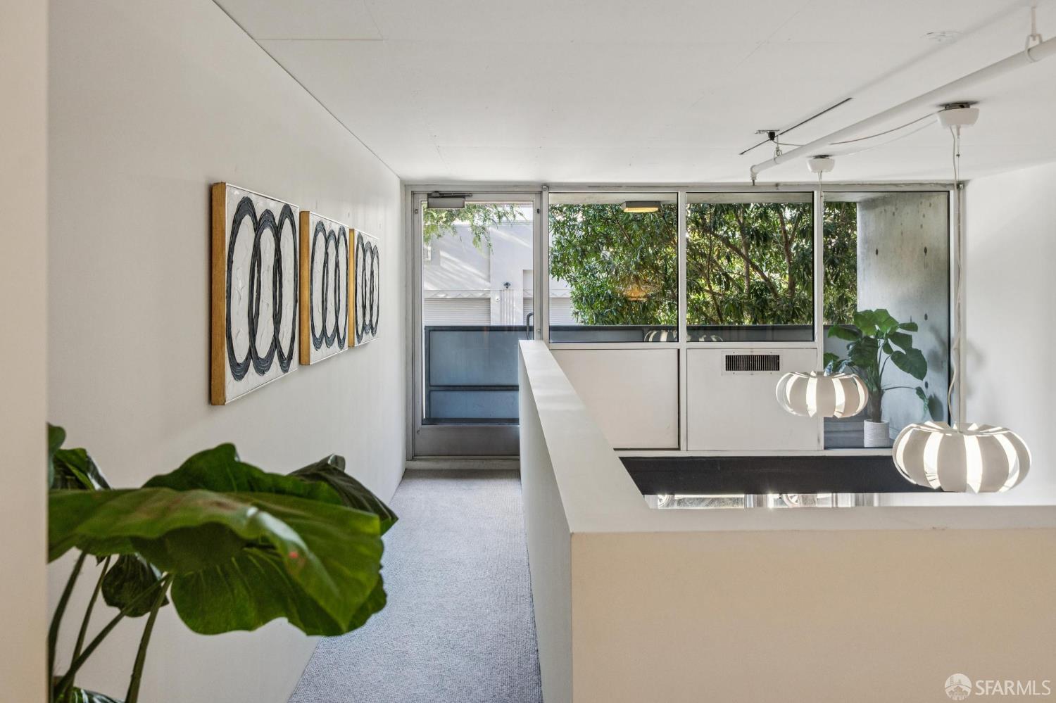 855 Folsom Street, Unit 112 San Francisco, CA 94107 - Photo 21 of 36 a living room with furniture and a potted plant