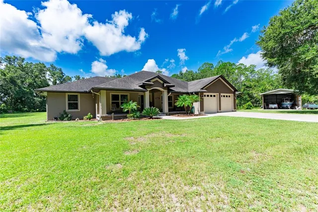 a front view of a house with yard