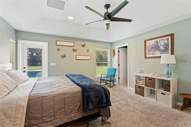 a work room with furniture and a large window