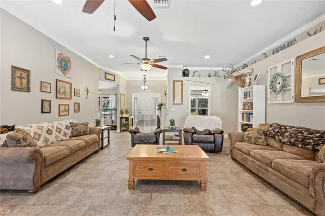 a view of a house with backyard sitting area and a tub